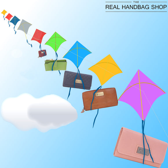 Collection of different coloured leather purses hanging from kites in the sky. 